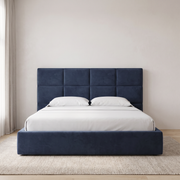 Velora Sleep Bed with Hydraulic Storage shown in navy blue fabric in a bright bedroom – illustrative image – Dune & Pine